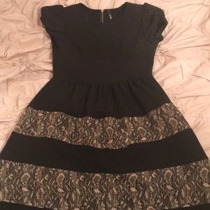Black dress with tan lace details in the skirt